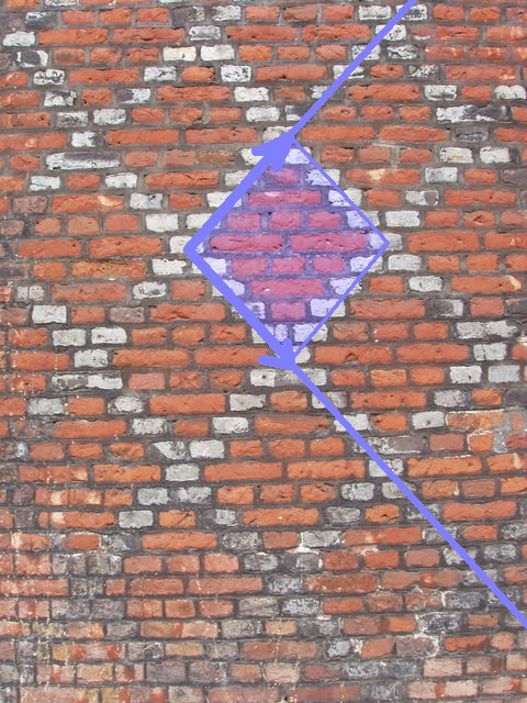 A brick wall with a primitive square unit cell.